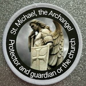 May include: White embroidered patch with black text and a black and white image of an angel. The text reads "St. Michael, the Archangel, Protector and guardian of the church."
