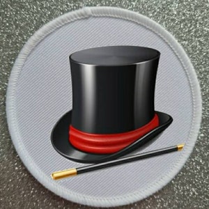 May include: A white round patch with a black top hat and a black and gold magic wand. The top hat has a red band around it.