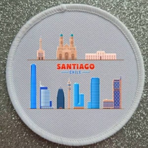 May include: A white round patch with a gray background featuring a cityscape of Santiago, Chile. The patch includes a church, skyscrapers, and the text "SANTIAGO -CHILE-".