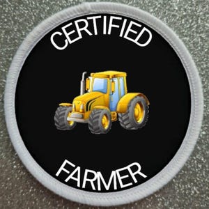 May include: A white and black round patch with the text "CERTIFIED FARMER" in white. A yellow cartoon tractor is in the center of the patch.