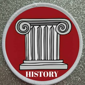 May include: A white and red circular patch with a white outline. The patch features a black and white illustration of a Greek column with the word "HISTORY" printed in white at the bottom.