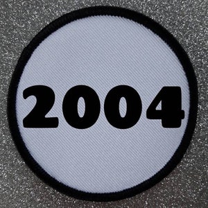 3 tums år 2004 stryk- eller sy-på sublimeringslappmärke