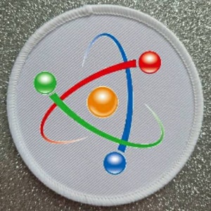 May include: White round patch with a colorful atom design. The atom has a red, orange, green, and blue color scheme.