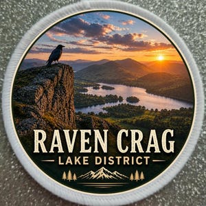 May include: Circular patch depicting a sunset over a lake in the Lake District, with a raven on a cliff. The text reads "RAVEN CRAG - LAKE DISTRICT" above a mountain and tree graphic, all within a white border.