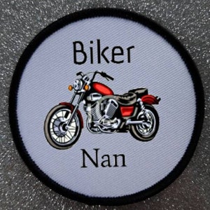 May include: A round patch with a motorcycle graphic and the text "Biker Nan".