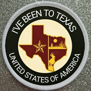 Pode incluir: Etiqueta redonda branca com texto preto e um gráfico do estado do Texas. O texto diz "I've Been To Texas United States of America".