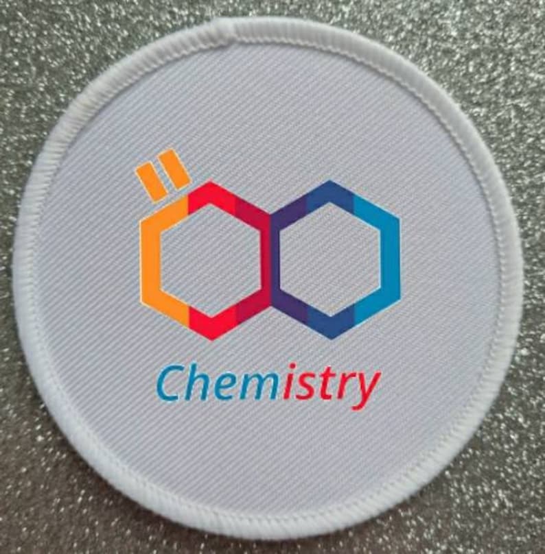 May include: White round patch with a colorful hexagonal logo and the word "Chemistry" printed below. The logo is made up of two hexagons, one orange and red, the other blue and purple, connected together.