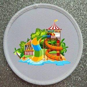 May include: A white fabric patch with a colorful cartoon illustration of a water slide at an amusement park. The slide is orange, green, and blue with a yellow top. The text "WATER SLIDE" is on the top of the slide.