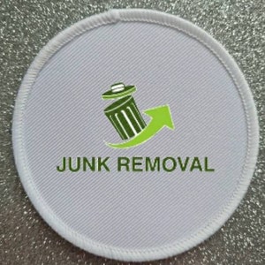 May include: White round patch with a green logo of a bin with an arrow pointing upwards. The text "JUNK REMOVAL" is printed in green below the logo.