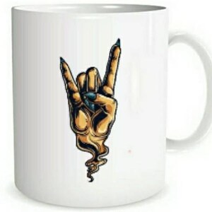May include: White ceramic mug with a graphic of a hand making the rock and roll hand gesture. The hand is yellow with blue fingernails and is surrounded by a smoke-like effect.