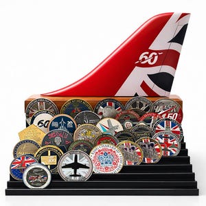 May include: A display featuring a red and white airplane tail fin with a Union Jack design and the number "60". The display also includes a collection of commemorative coins with various designs and text.