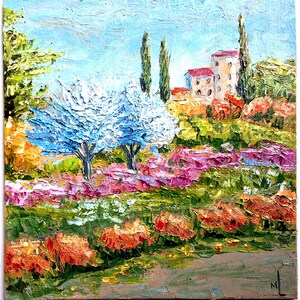 May include: An oil painting on canvas depicting a landscape with thick, textured brushstrokes. The scene features two prominent white-flowering trees, a field of pink and green vegetation, orange bushes in the foreground, and a building in the distance.