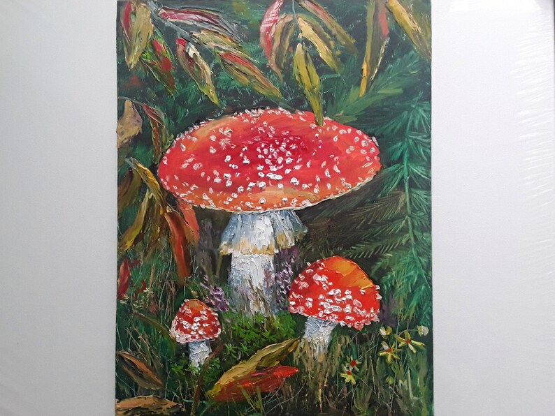 May include: A painting of three red and white mushrooms with white spots in a forest setting. The mushrooms are painted in a realistic style with visible details like the gills and the stem.