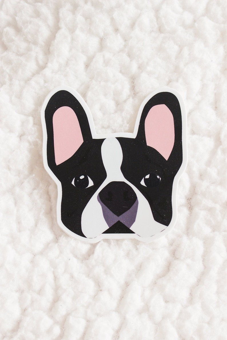 May include: A black and white cartoon illustration of a French bulldog's face with pink ears. The bulldog is looking directly at the viewer.