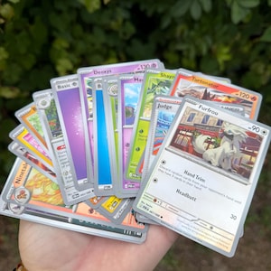 Pokémon Mystery Pack -20 Random Cards and Collector Extras -Stickers, Coins, Dice & Surprise Items - Trading Card Gift Bundle