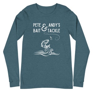 May include: Teal long-sleeve shirt with white text that reads "Pete & Andy's Bait & Tackle" and a white silhouette of a fish jumping out of the water with a fishing line and hook.