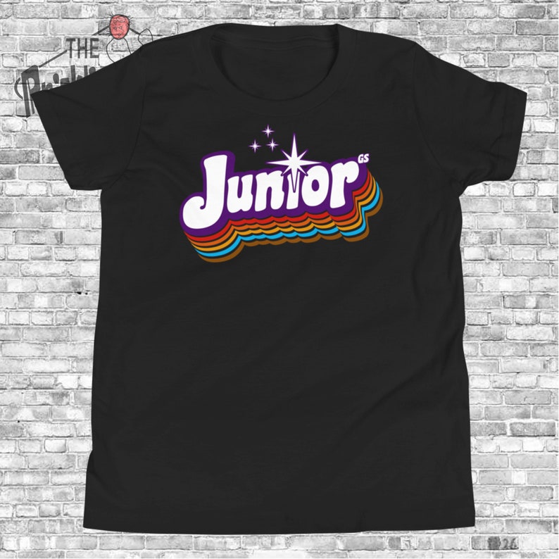 May include: Black t-shirt with a retro-style rainbow graphic of the word "Junior" with a star and a small "GS" in the top right corner.