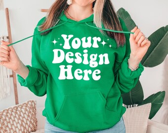 May include: A bright green hooded sweatshirt with the text "Your Design Here" in white retro-style lettering.