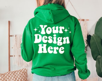 May include: A green hooded sweatshirt with the text "Your Design Here" in white on the back.