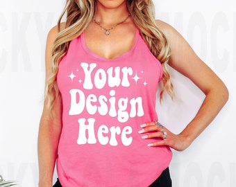 May include: A pink tank top with a white graphic that says "Your Design Here".