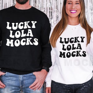 May include: Two black and white sweatshirts with the text "Lucky Lola Mocks" in a retro font.