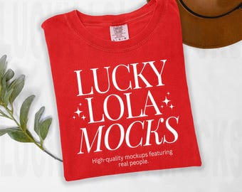 May include: Red t-shirt with white text that reads "Lucky Lola Mock's" and "High-quality mockups featuring real people."