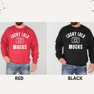 May include: Two mockups of a sweatshirt with the text "Lucky Lola Mocks" and a camera graphic. The sweatshirt is shown in red and black.