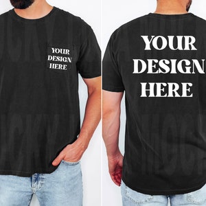 May include: A black t-shirt with short sleeves and a pocket on the left side. The text "YOUR DESIGN HERE" is printed on the front and back of the shirt.