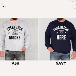 May include: Two sweatshirts, one ash grey and one navy blue, with a camera graphic and text. The ash grey sweatshirt has the text "Lucky Lola Mocks" and the navy blue sweatshirt has the text "Your Design Here".