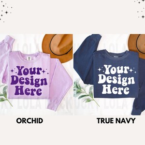May include: Two sweatshirts, one orchid purple and one true navy, with the text "Your Design Here" in a retro font.