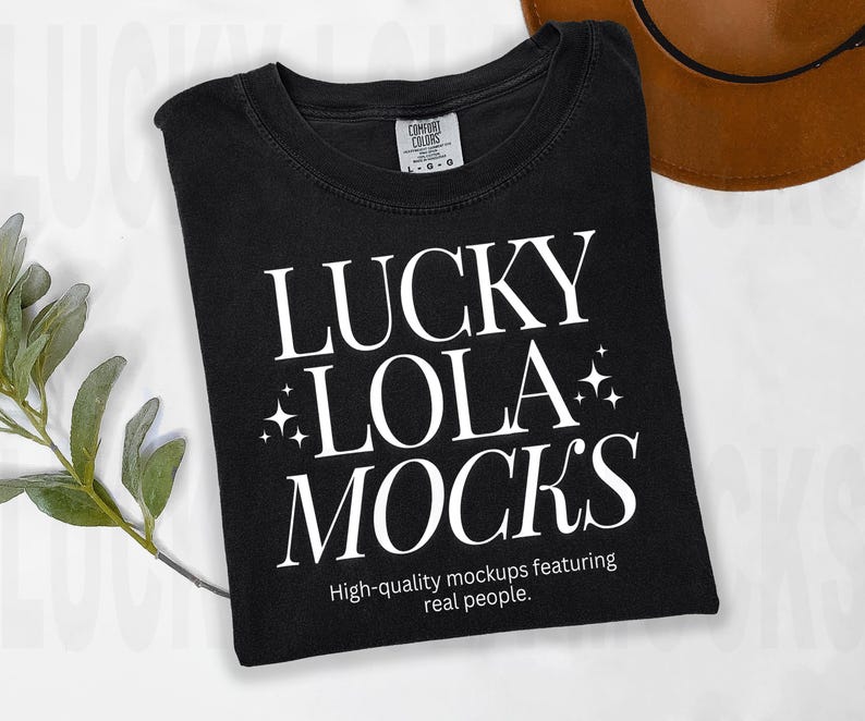 May include: Black t-shirt with white text that reads "Lucky Lola Mock's" and "High-quality mockups featuring real people."
