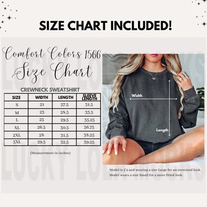 May include: Size chart for a crewneck sweatshirt in Comfort Colors 1566. The chart shows the width, length, and sleeve length in inches for sizes S, M, L, XL, 2XL, and 3XL.