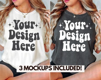 May include: Two women wearing white and gray t-shirts with the text "Your Design Here" in a retro font. The shirts are a mockup for a design project.