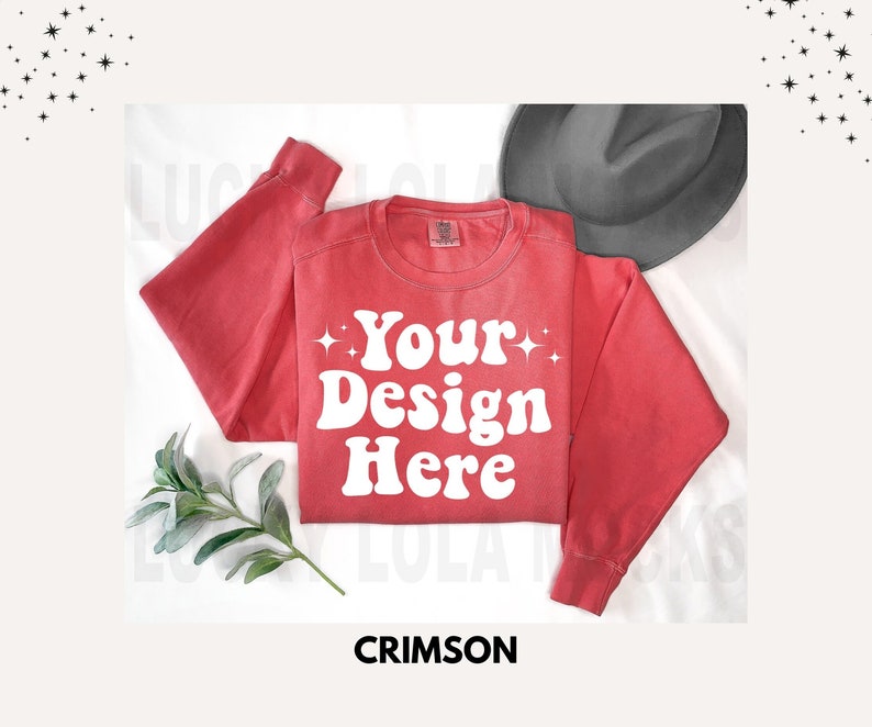 May include: Crimson red sweatshirt with a white graphic that says "Your Design Here" in a retro font. The sweatshirt is laying flat on a white surface.