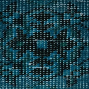 May include: A close-up of a blue and black patterned fabric with a textured surface.