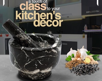 May include: A black and white marble mortar and pestle set. The mortar is round with a matching pestle. The image includes the text "a touch of class to your kitchen's decor" and "DETERGENT SAFE".