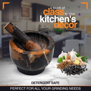 May include: A black and orange marble mortar and pestle set. The mortar is round with a matching pestle. The image includes the text "a touch of class to your kitchen's decor" and "DETERGENT SAFE".