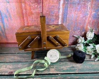 Vintage wooden sewing box with floral decor