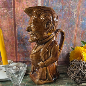 French majolica barbotine pitcher man with a barb