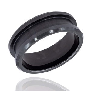 May include: A black tungsten carbide ring with a beveled edge and a brushed finish.