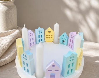 Corona de casas fundida en Raysin, casas de colores pastel, ciudad arcoíris con velas, Adviento de Navidad