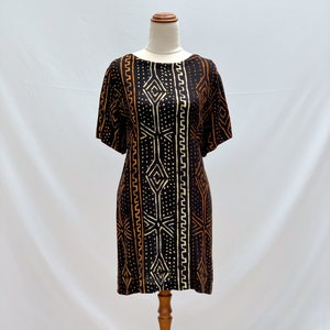 Reworked vintage 1990s black mini dress with tribal print.