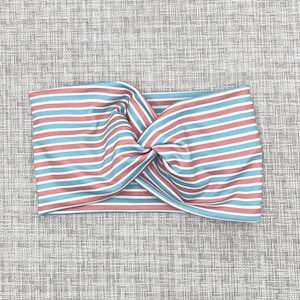 Wide, twisted headband with pink, blue, and white, stripe print.