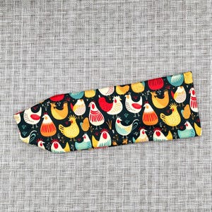 Navy blue headband with chicken print.