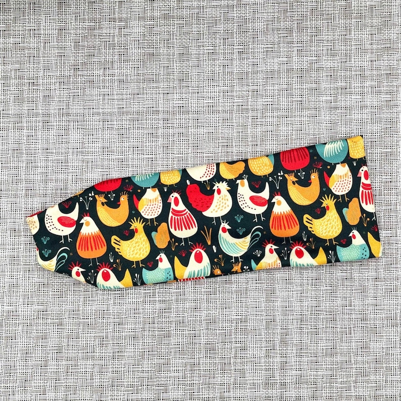Navy blue headband with chicken print.