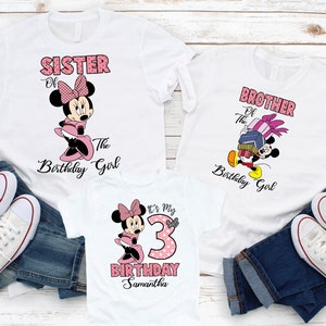 May include: Three white t-shirts with pink and black Mickey Mouse and Minnie Mouse graphics. The shirts say "Sister of the Birthday Girl", "Brother of the Birthday Girl", and "It's My 3rd Birthday Samantha".