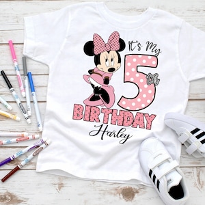May include: White t-shirt with a pink and white polka dot Minnie Mouse design. The shirt says "It's My 5th Birthday Harley".
