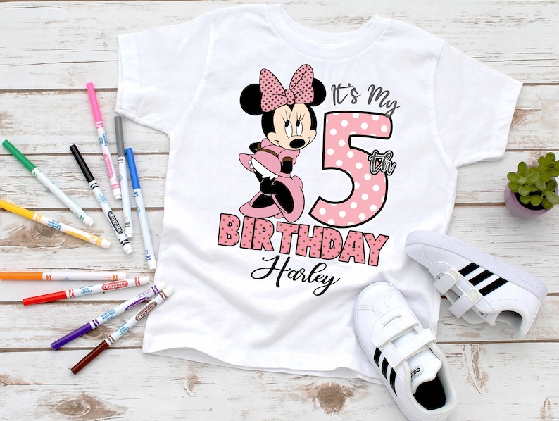 May include: White t-shirt with a pink and white polka dot Minnie Mouse design. The shirt says "It's My 5th Birthday Harley".