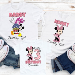 May include: Three white t-shirts with a pink and black Minnie Mouse design. The shirts say "Daddy of the Birthday Girl", "Mommy of the Birthday Girl", and "It's My 3rd Birthday Samantha".