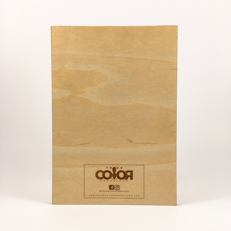 May include: A wooden sign with the text "Four Color Creations" and a logo of four coloured squares. The sign also includes the text "#fourcolorcreations" and "www.fourcolorcreations.com".